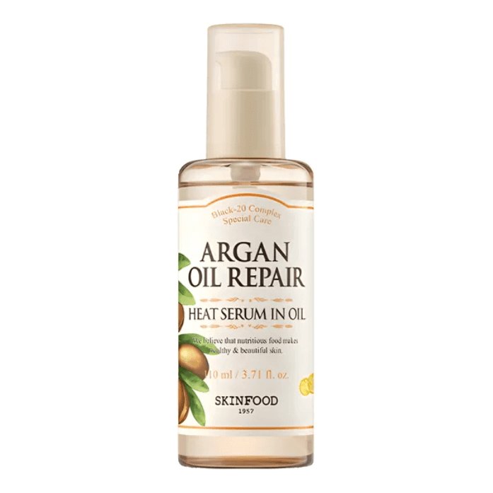 SKINFOOD - Argan Oil Repair Plus Heat Serum in Oil bottle with botanical oils for hair protection and nourishment.