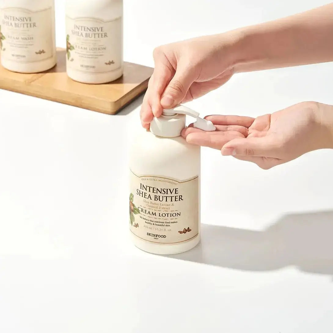 Person dispensing SKINFOOD Intensive Shea Butter Cream Lotion 450ml with an easy-pump bottle.