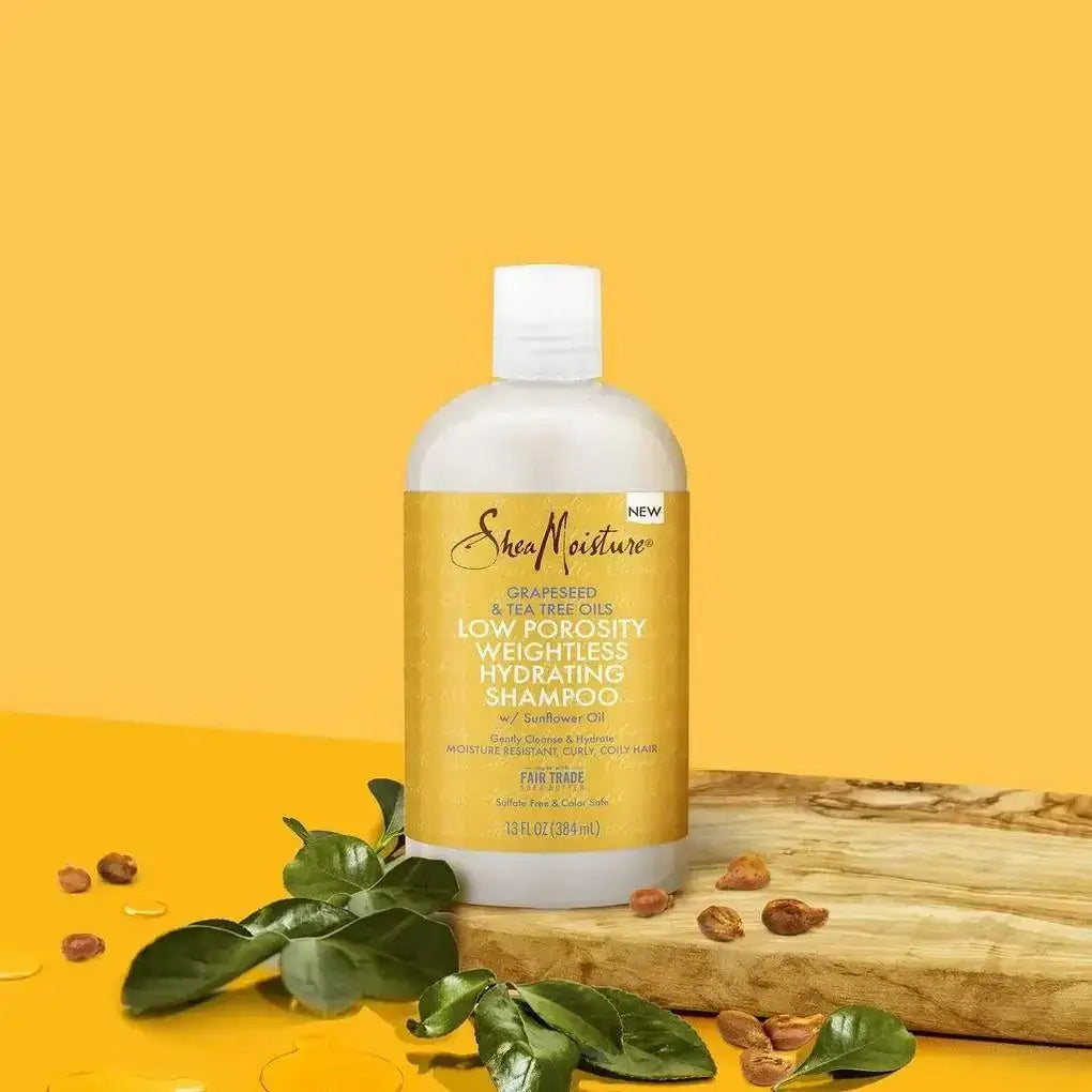Shea Moisture shampoo review: low porosity weightless hydrating shampoo bottle on a yellow background.
