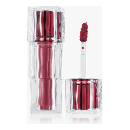 TIR TIR Hydrating & Glowlasting Waterism Glow Tint in clear packaging with applicator and rich red shade.