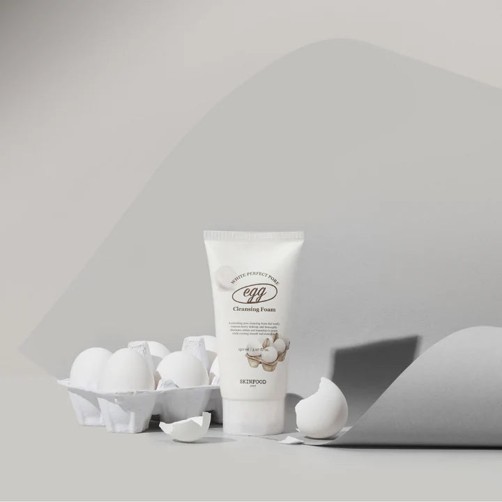 SKINFOOD Egg White Perfect Pore Cleansing Foam with eggs in a minimalist setting