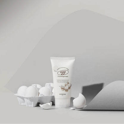 SKINFOOD Egg White Perfect Pore Cleansing Foam with eggs in a minimalist setting