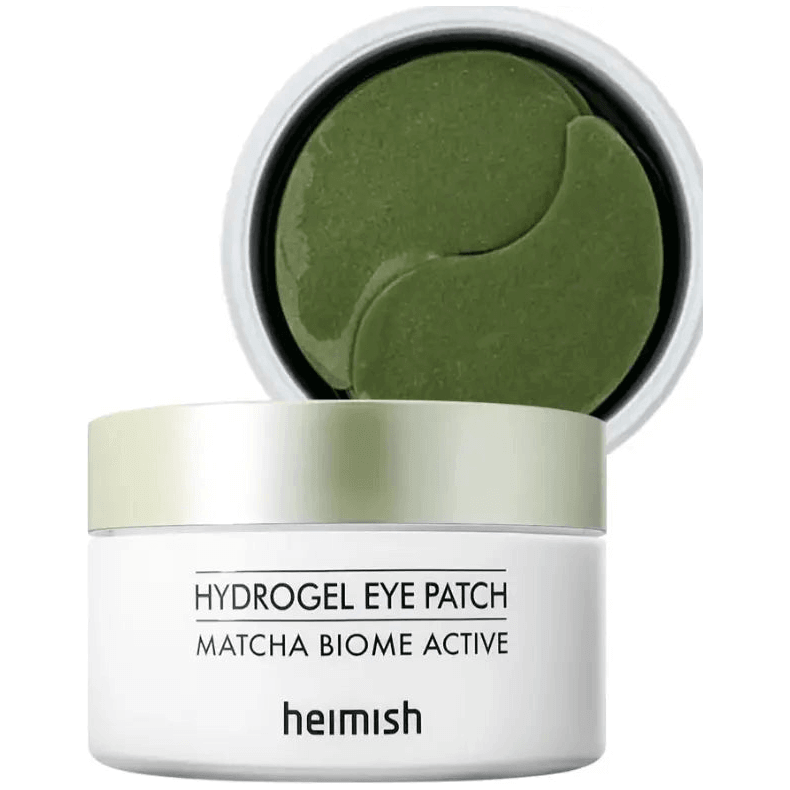HEIMISH Matcha Biome Hydrogel Eye Patch in jar with green patches for soothing and anti-aging effects.