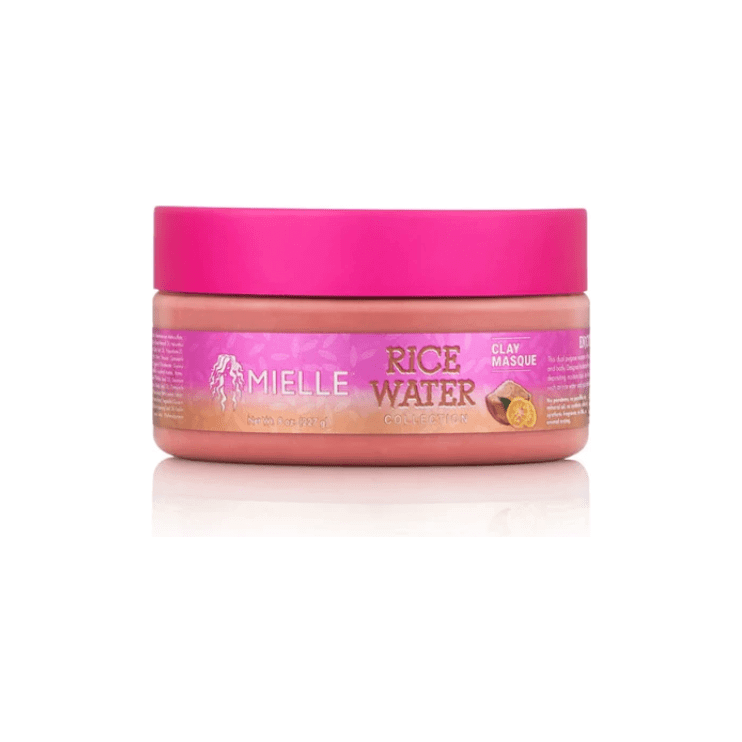 Mielle Organics Rice Water Clay Masque in a pink container for hair and body detox, restoring moisture with rice water and yuzu.