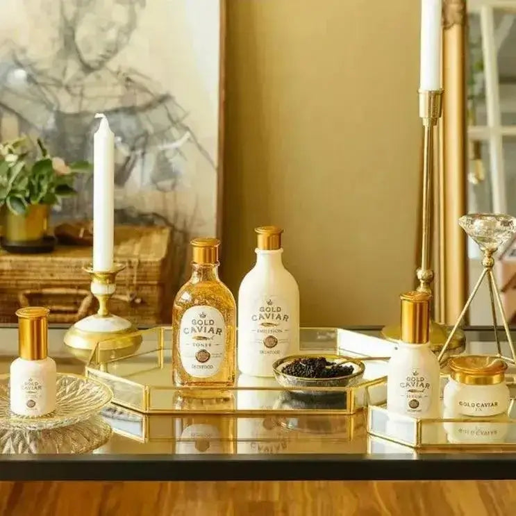 SKINFOOD Gold Caviar Ex Lifting Eye Serum 32ml displayed alongside other Gold Caviar products on a chic vanity.